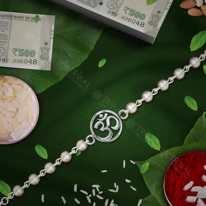 Trendy 925 sterling silver unique style Aum or OM pendant Rakhi bracelet in rudrakshblack basilwhite basil and silver beaded chain rk270 TRIBAL ORNAMENTS Bracelets Trendy 925 sterling silver unique style Aum or OM pendant Rakhi bracelet in rudrakshblack basilwhite basil and silver beaded chain rk270 TRIBAL ORNAMENTS Bracelets