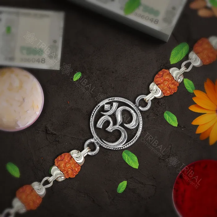 Trendy 925 sterling silver unique style Aum or OM pendant Rakhi bracelet in rudrakshblack basilwhite basil and silver beaded chain rk270 TRIBAL ORNAMENTS Bracelets Trendy 925 sterling silver unique style Aum or OM pendant Rakhi bracelet in rudrakshblack basilwhite basil and silver beaded chain rk270 TRIBAL ORNAMENTS Bracelets