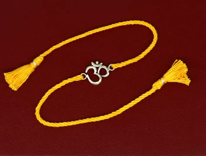 TRIBAL ORNAMENTS Bracelets 925 sterling silver custom design OM AUM design Rakhi bracelet with stunning yellow thread Best sibling rakhi for Festival Rakshabandhan rk161